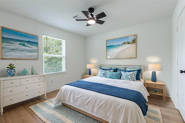 a bathroom with a toilet sink a shower and mirror