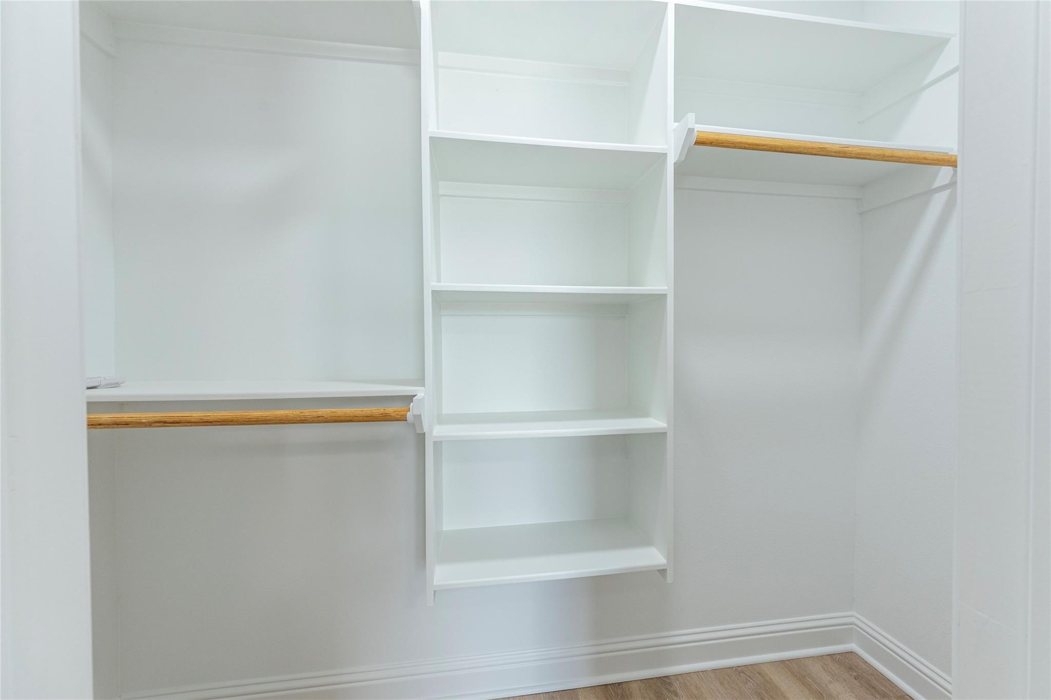 4213 Houx Street Bacliff, TX 77518 - Photo 21 of 37 a view of walk in closet with empty racks