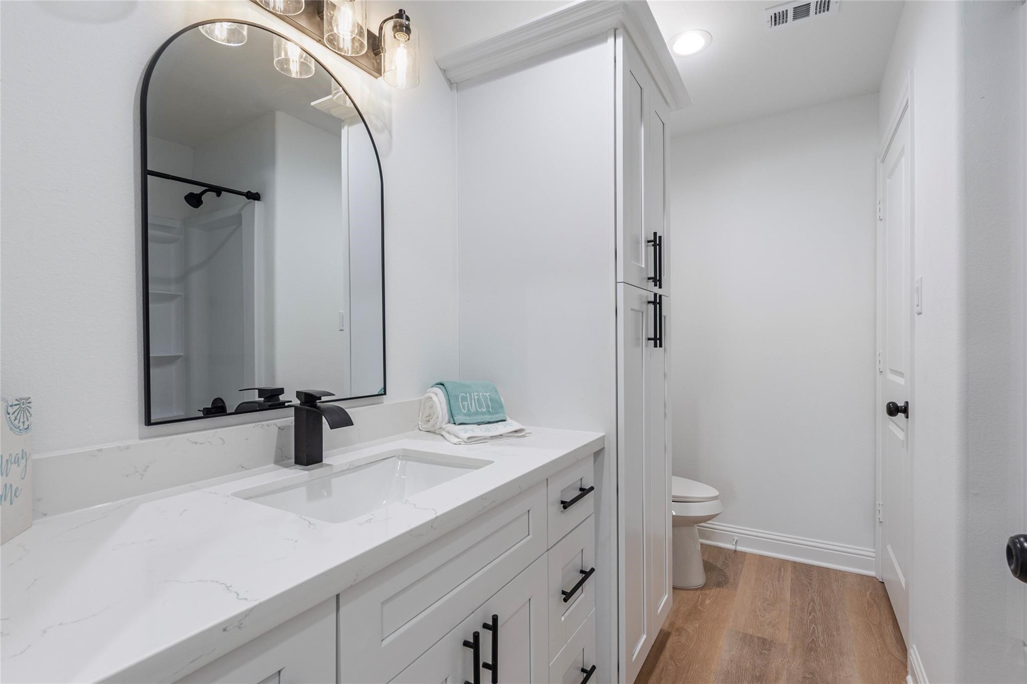 4213 Houx Street Bacliff, TX 77518 - Photo 23 of 37 a bathroom with a sink and a mirror