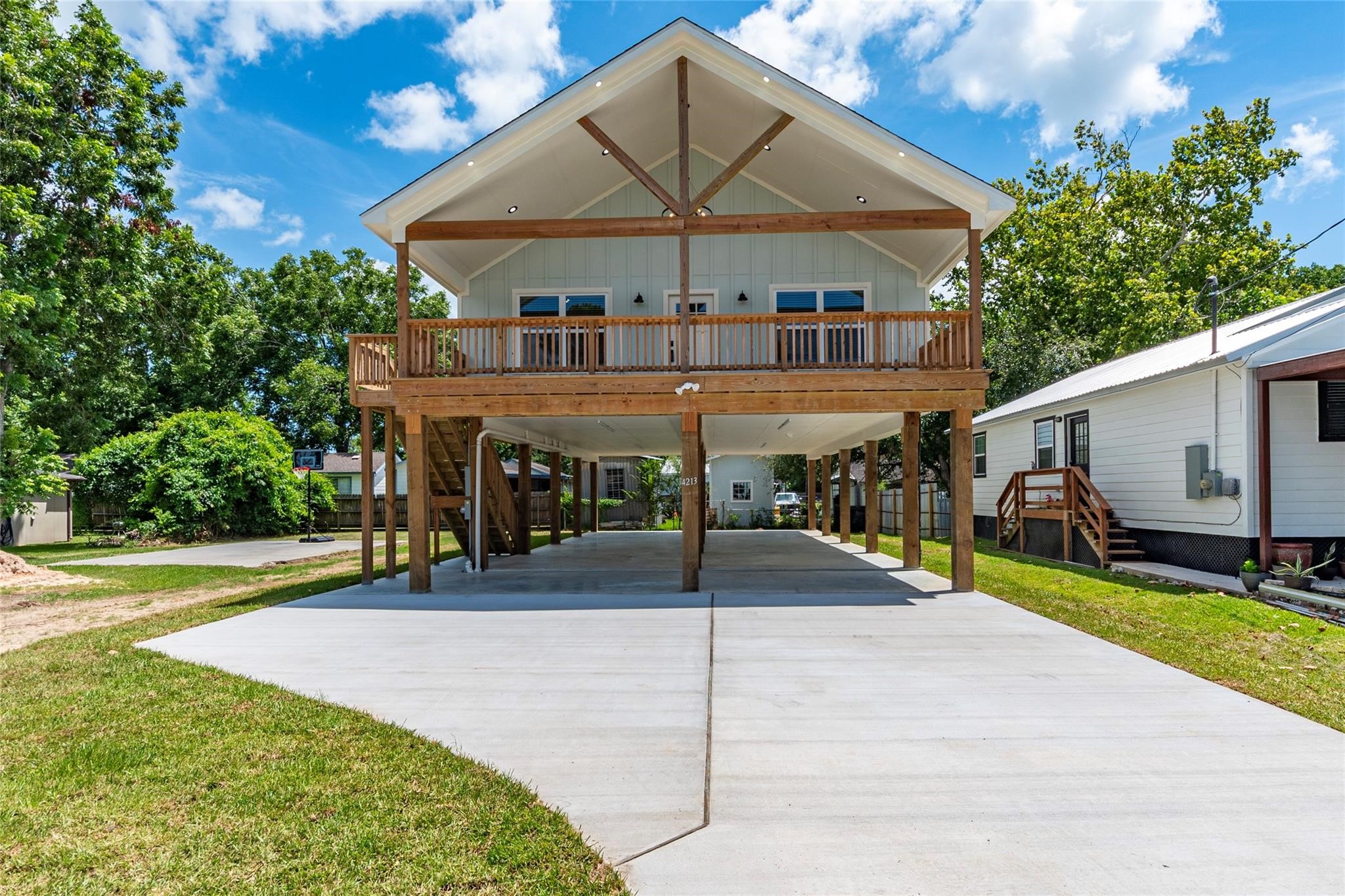 4213 Houx Street Bacliff, TX 77518 - Photo 28 of 37 a view of a house with a swimming pool