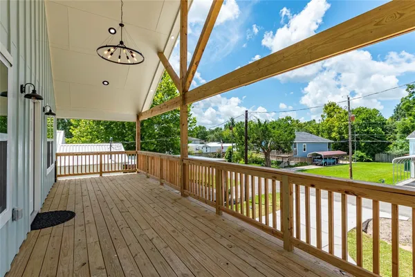 a view of a porch with wooden floor