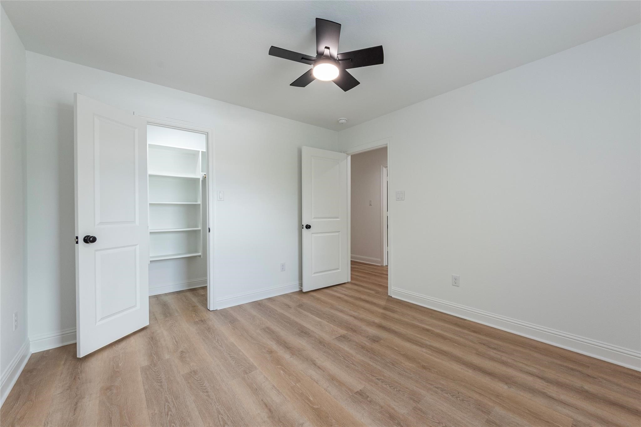 4213 Houx Street Bacliff, TX 77518 - Photo 36 of 37 a view of empty room with wooden floor and ceiling fan