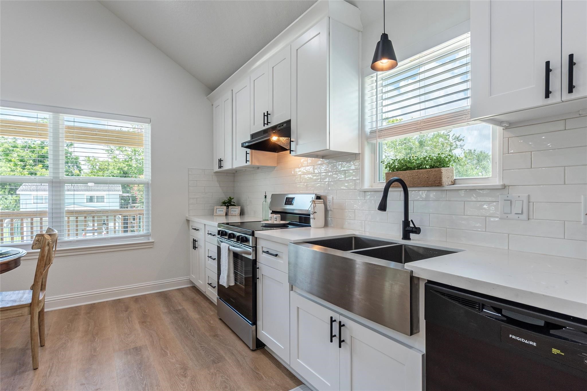 4213 Houx Street Bacliff, TX 77518 - Photo 9 of 37 a kitchen with a sink stove and cabinets