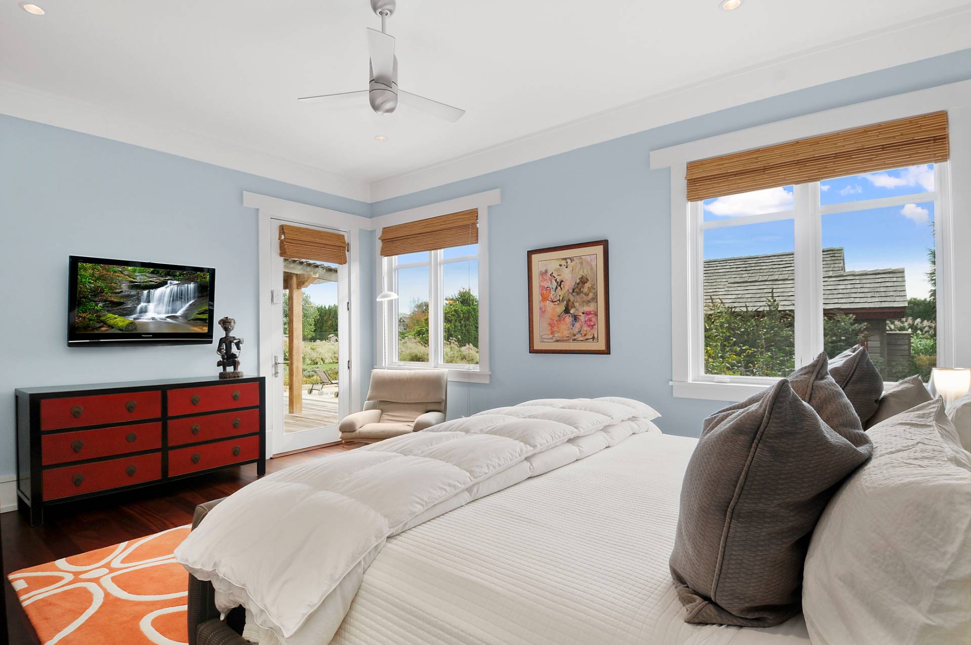 807 Halsey Lane Bridgehampton, NY 11932 - Photo 8 of 9 a bedroom with a bed and a television