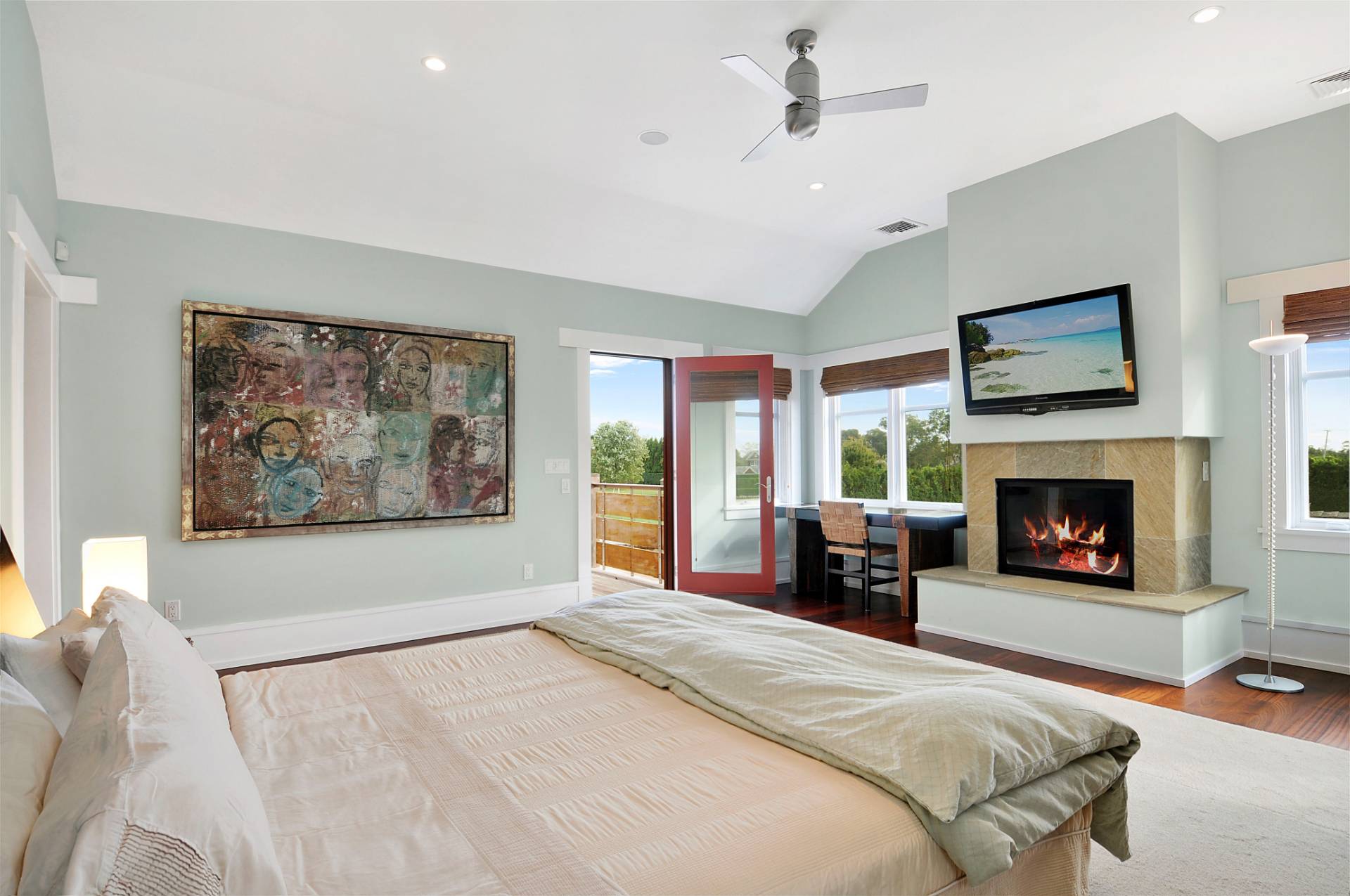 807 Halsey Lane Bridgehampton, NY 11932 - Photo 9 of 9 a spacious bedroom with a large bed and a fireplace