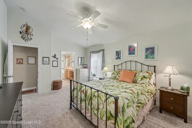 a bedroom with a bed and a lamp