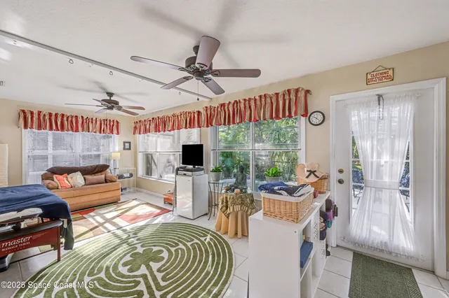 a view of a swimming pool with a patio and plants