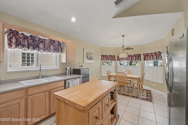 a spacious bathroom with a granite countertop sink a mirror and a shower