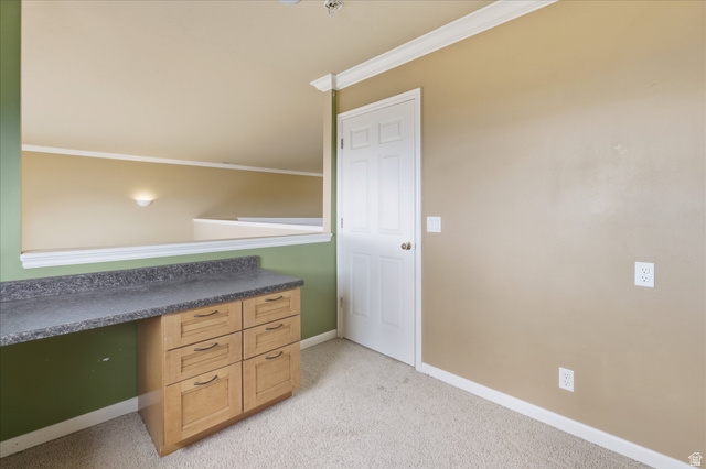 2887 View Crest Circle North Logan, UT 84341 - Photo 18 of 37 Office area featuring ornamental molding, light carpet, and built in study area