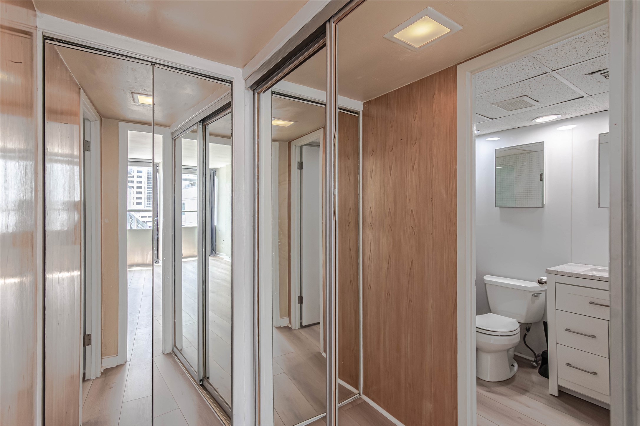 1800 Lavaca Street, Unit A705 Austin, TX 78701 - Photo 13 of 18 a bathroom with a toilet a sink and shower