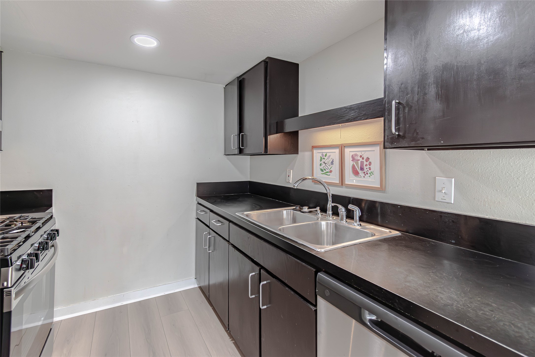 1800 Lavaca Street, Unit A705 Austin, TX 78701 - Photo 6 of 18 a bathroom with a sink and a mirror