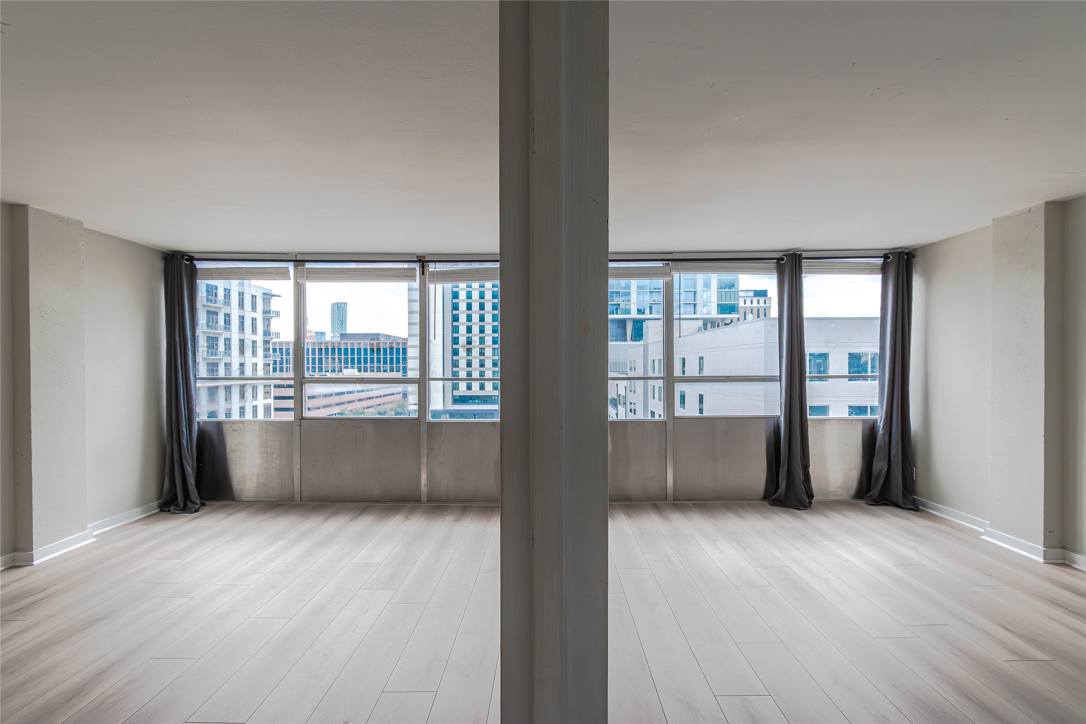 1800 Lavaca Street, Unit A705 Austin, TX 78701 - Photo 8 of 18 wooden floor in an empty room with a window