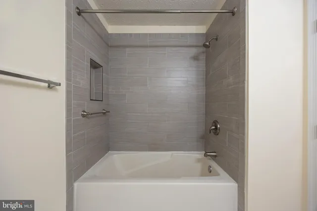 a bathroom with a toilet sink a mirror and vanity