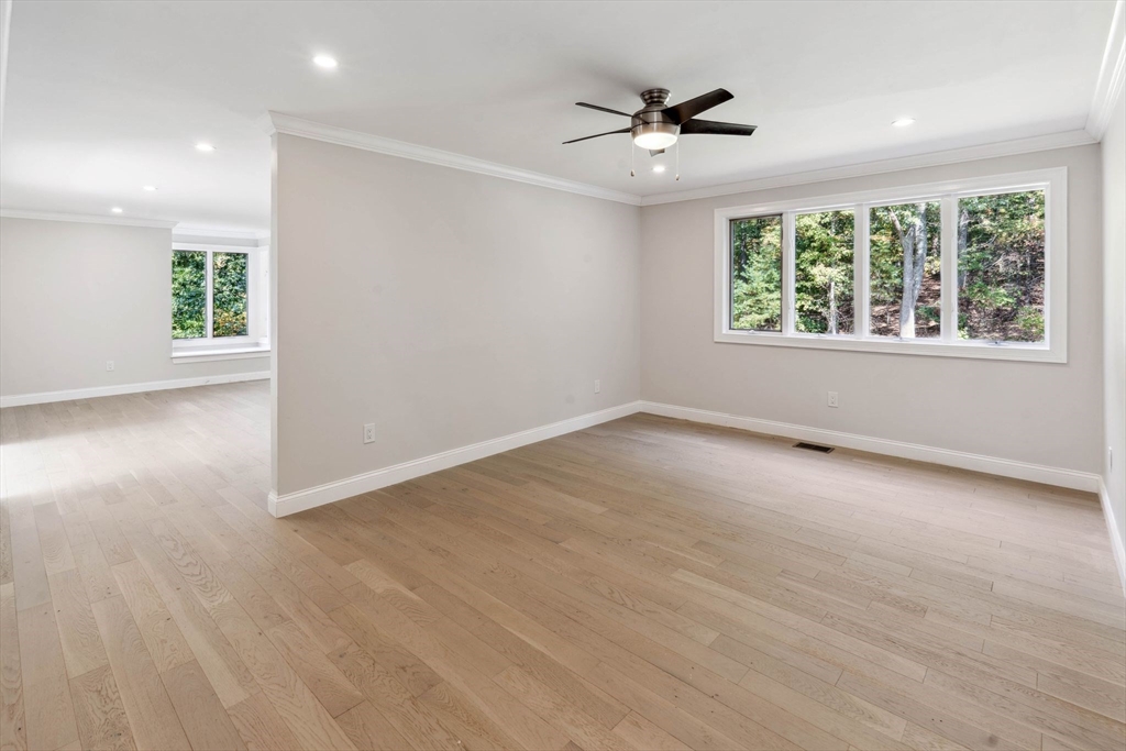 18 Pheasant Street Topsfield, MA 01983 - Photo 13 of 42 an empty room with wooden floor and windows