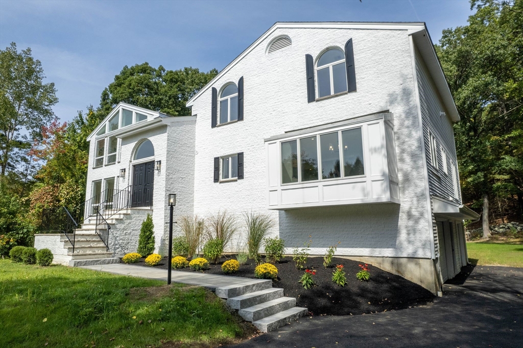 18 Pheasant Street Topsfield, MA 01983 - Photo 2 of 42 a front view of a house with garden