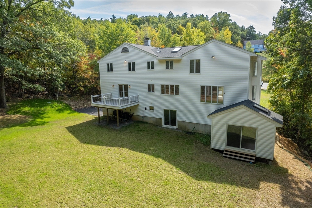 18 Pheasant Street Topsfield, MA 01983 - Photo 38 of 42 a front view of a house with garden