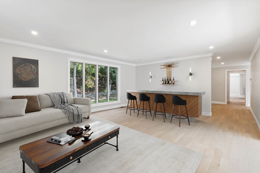 18 Pheasant Street Topsfield, MA 01983 - Photo 10 of 42 a living room with furniture and a large window