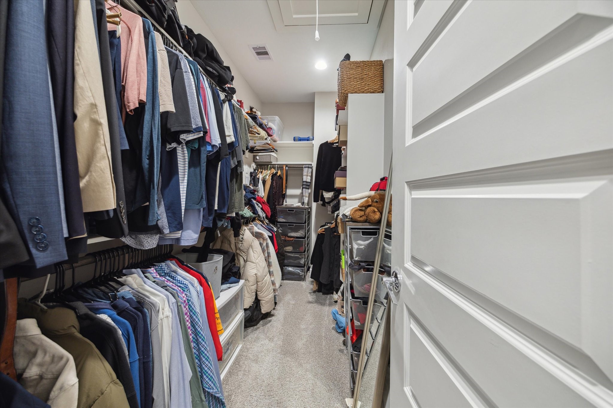 9414 Campbell Road, Unit F Houston, TX 77080 - Photo 17 of 26 a view of walk in closet with clothes