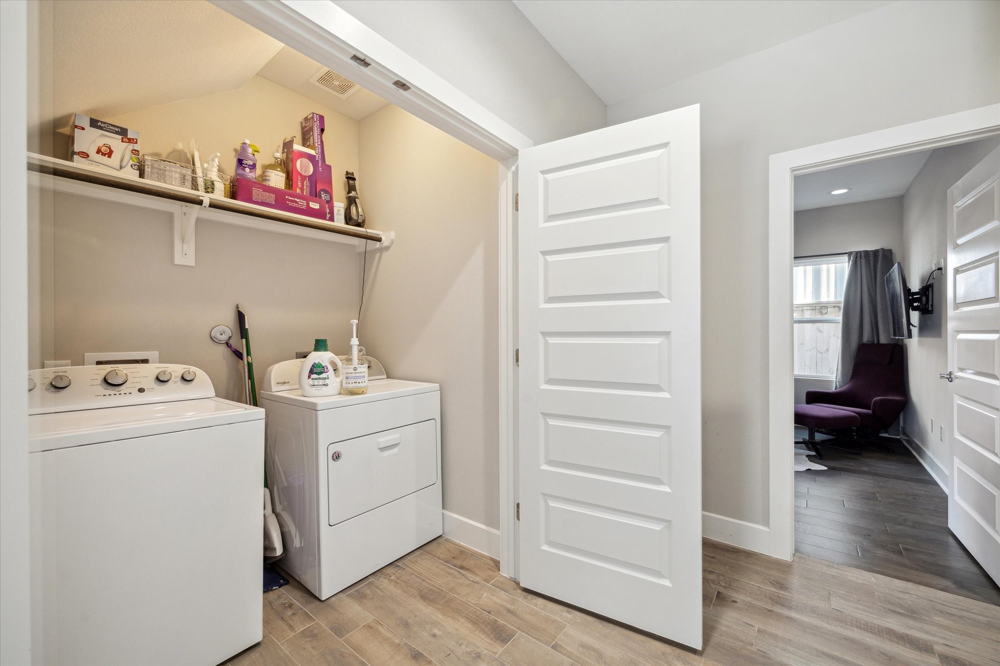 9414 Campbell Road, Unit F Houston, TX 77080 - Photo 21 of 26 a view of storage and utility room with washer and dryer