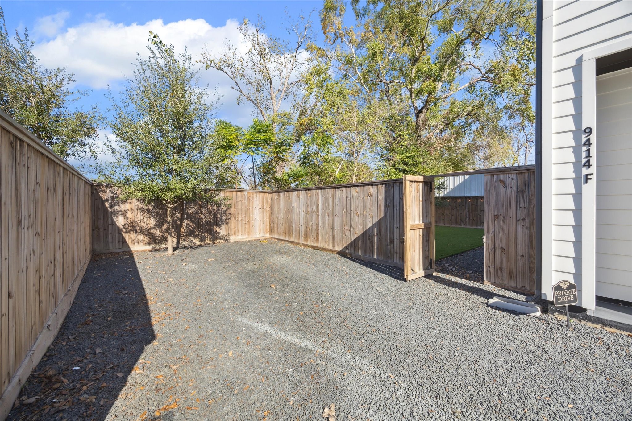 9414 Campbell Road, Unit F Houston, TX 77080 - Photo 23 of 26 a view of a house with a tree in the background