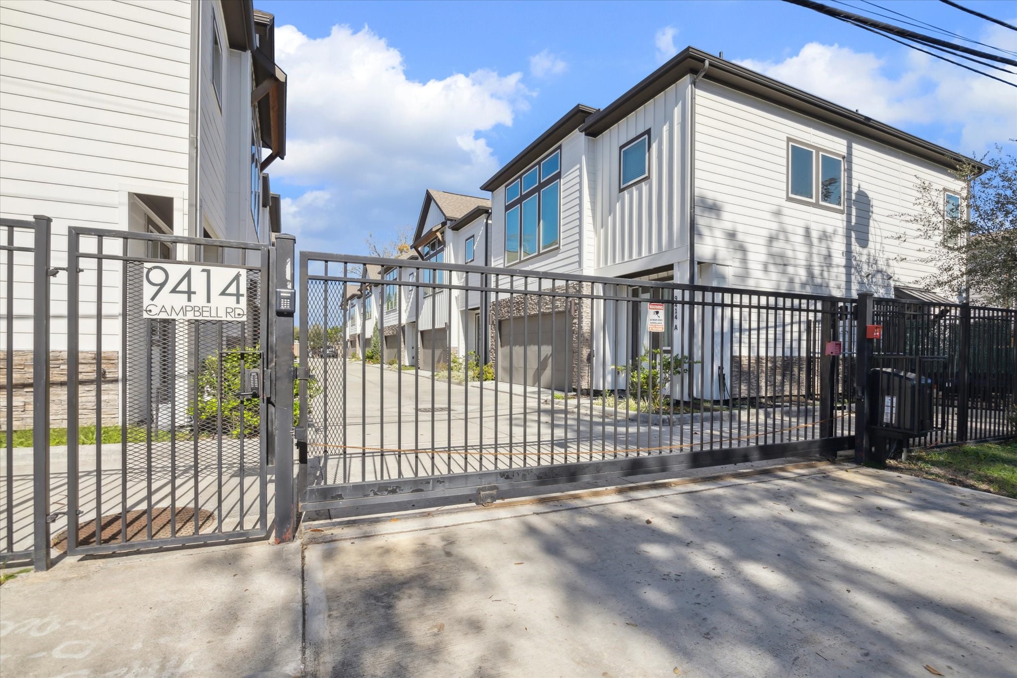9414 Campbell Road, Unit F Houston, TX 77080 - Photo 26 of 26 a view of a house with iron fence