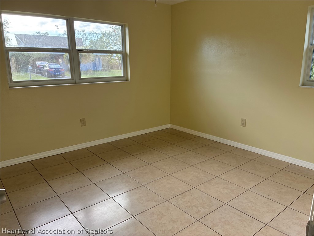 1525 Lagrange Avenue Sebring, FL 33870 - Photo 9 of 16 an empty room with a window