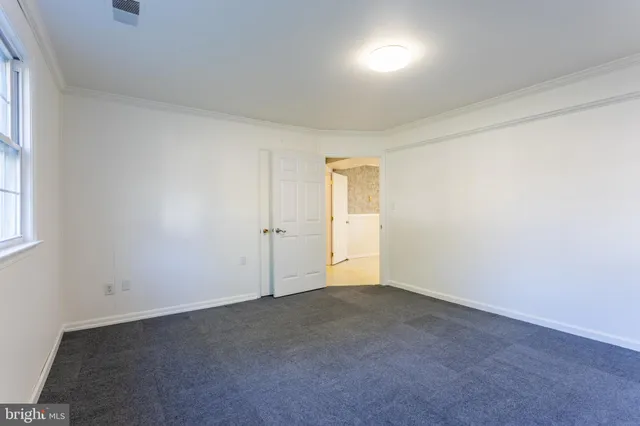 a view of an empty room and window