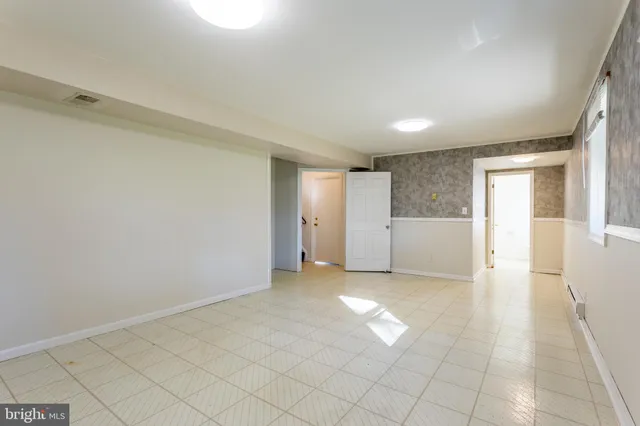 a view of an empty room and window