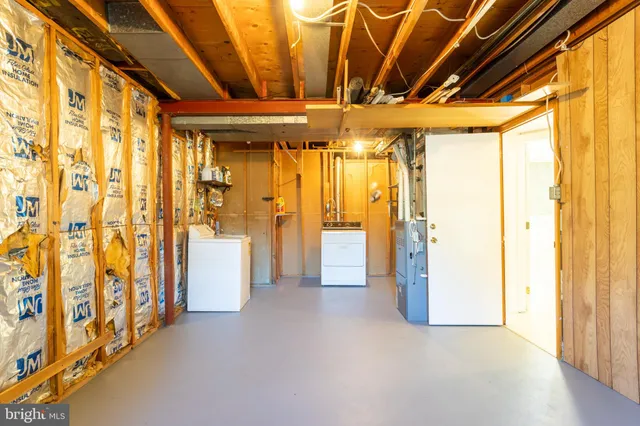 a view of hallway with furniture and shower