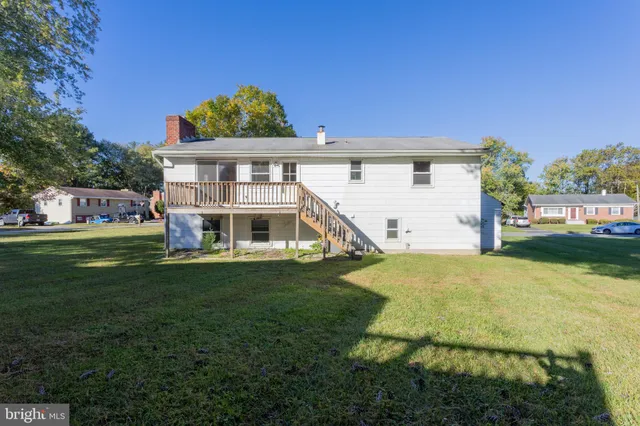 a view of a big house with a big yard
