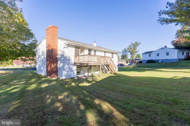a view of a big room with a big yard and potted plants