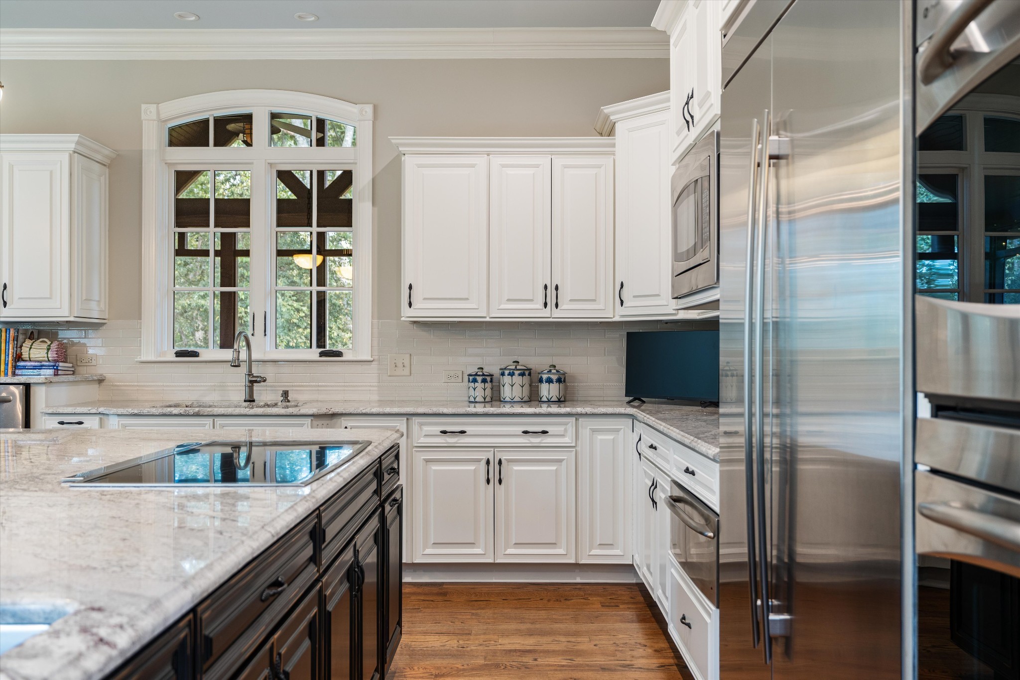 1521 Registry Row Arrington, TN 37014 - Photo 17 of 54 a kitchen with stainless steel appliances granite countertop a sink stove and refrigerator