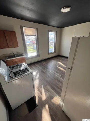 a view of gallery with wooden floor