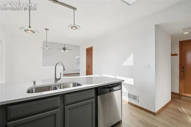 a kitchen with a sink and cabinets