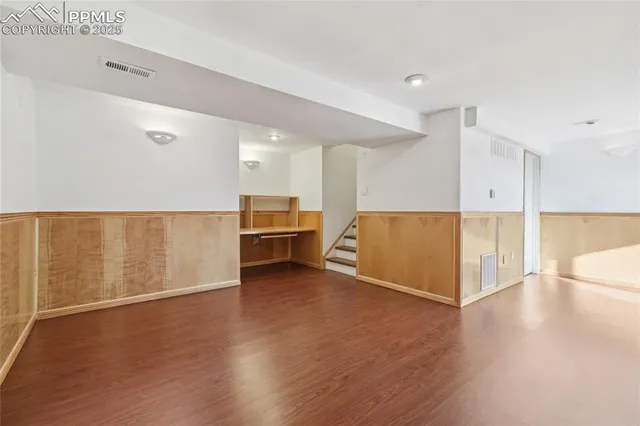 a view of a kitchen with wooden floor