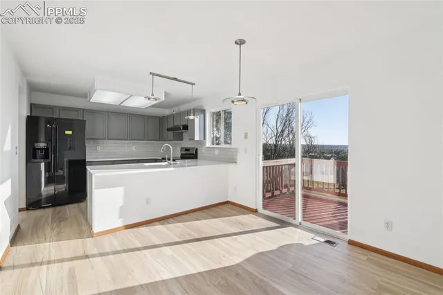 a view of a kitchen with cabinets