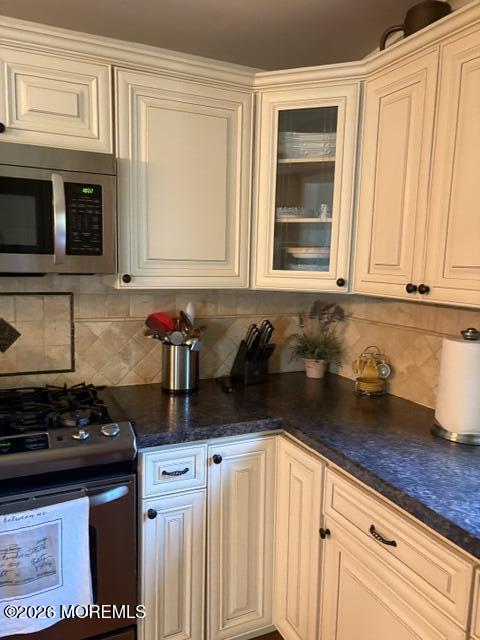 39 Hibiscus Place, Unit A Jackson, NJ 08527 - Photo 9 of 39 a kitchen with granite countertop a stove a sink and cabinets