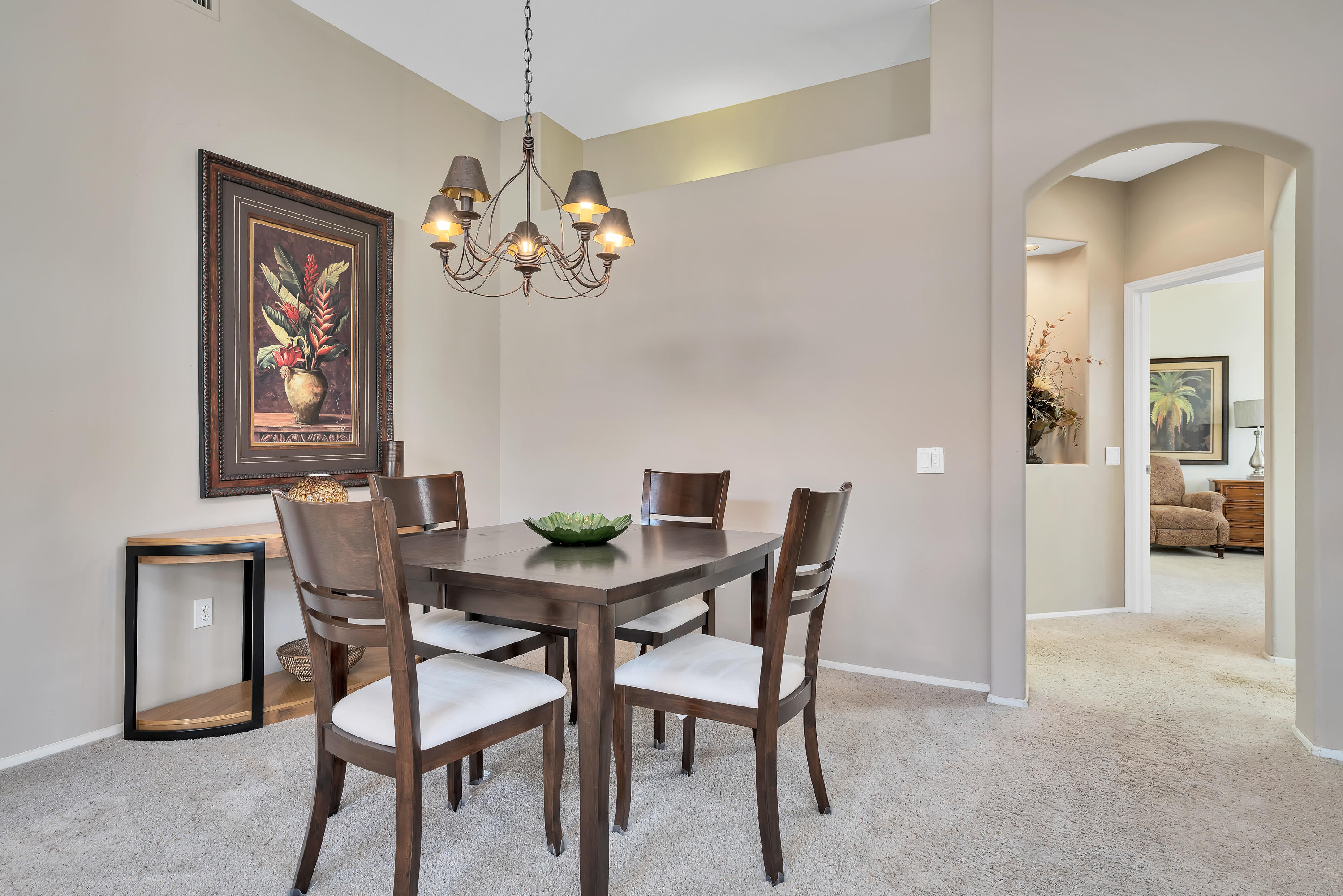 37395 Purple Shadow Road Palm Desert, CA 92211 - Photo 11 of 19 a view of a dining room with furniture and chandelier