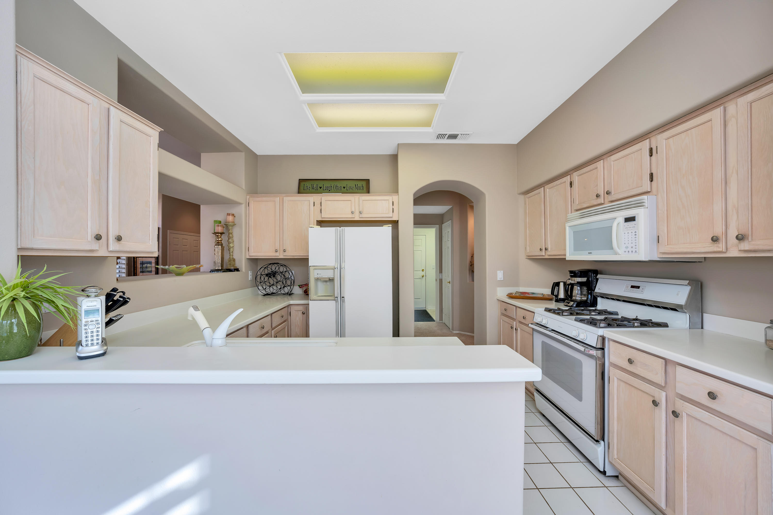 37395 Purple Shadow Road Palm Desert, CA 92211 - Photo 13 of 19 a kitchen with cabinets a sink and appliances
