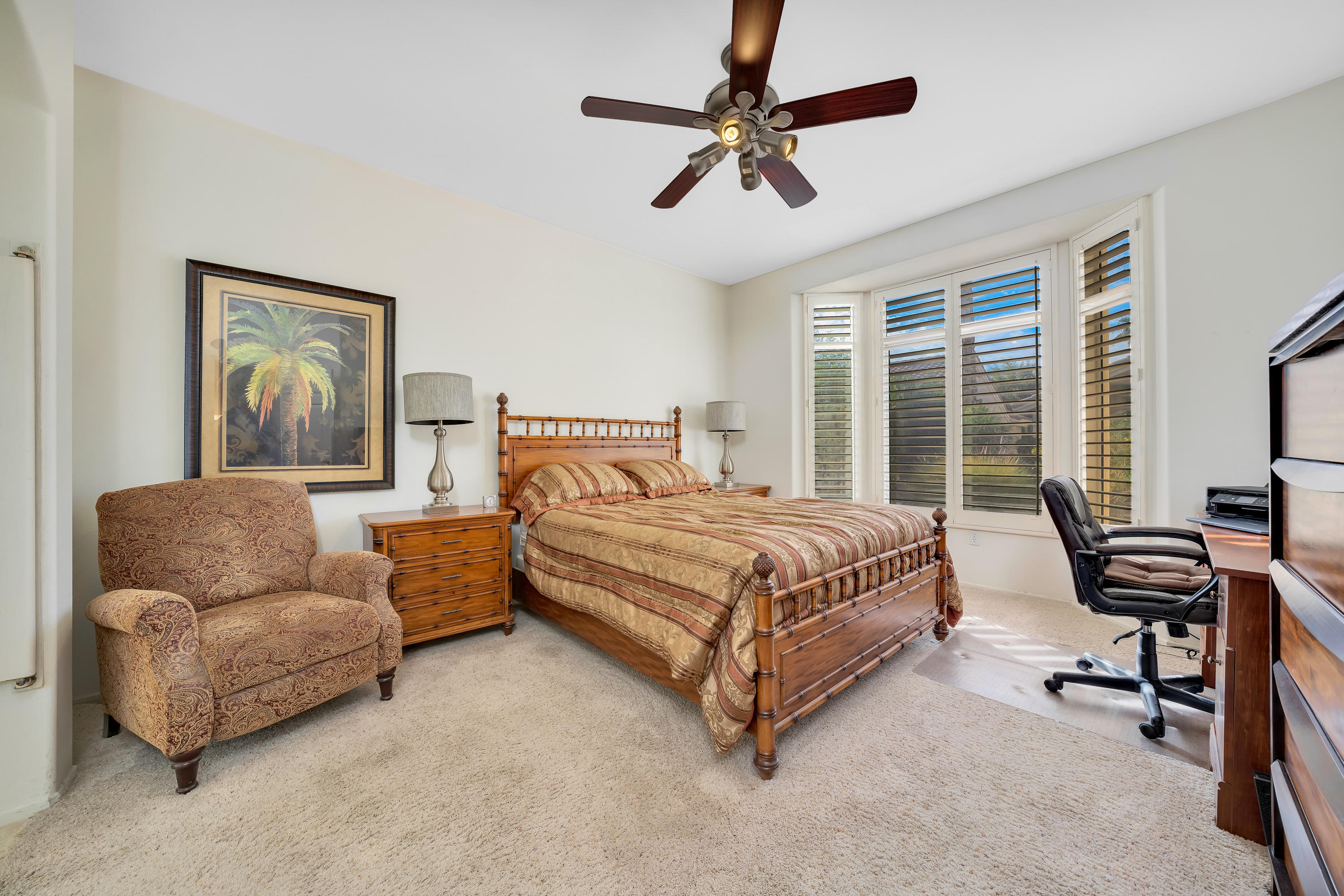 37395 Purple Shadow Road Palm Desert, CA 92211 - Photo 15 of 19 a bedroom with furniture and a ceiling fan