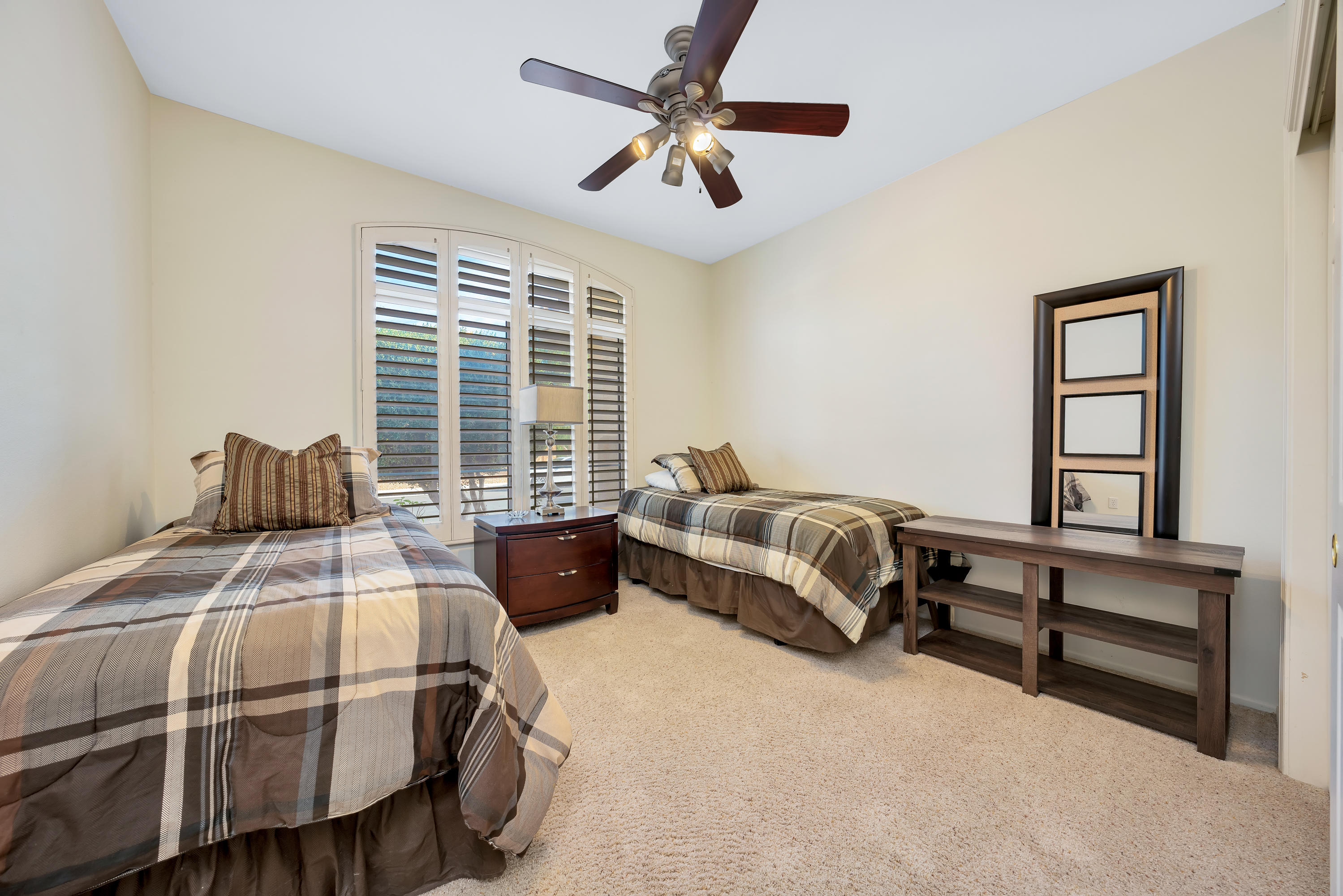 37395 Purple Shadow Road Palm Desert, CA 92211 - Photo 17 of 19 a bedroom with a bed and a window