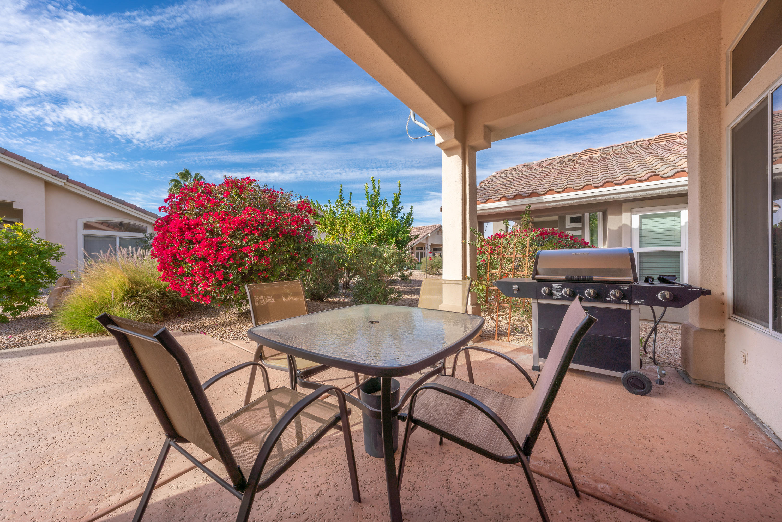 37395 Purple Shadow Road Palm Desert, CA 92211 - Photo 4 of 19 a view of a dining room with furniture and chandelier