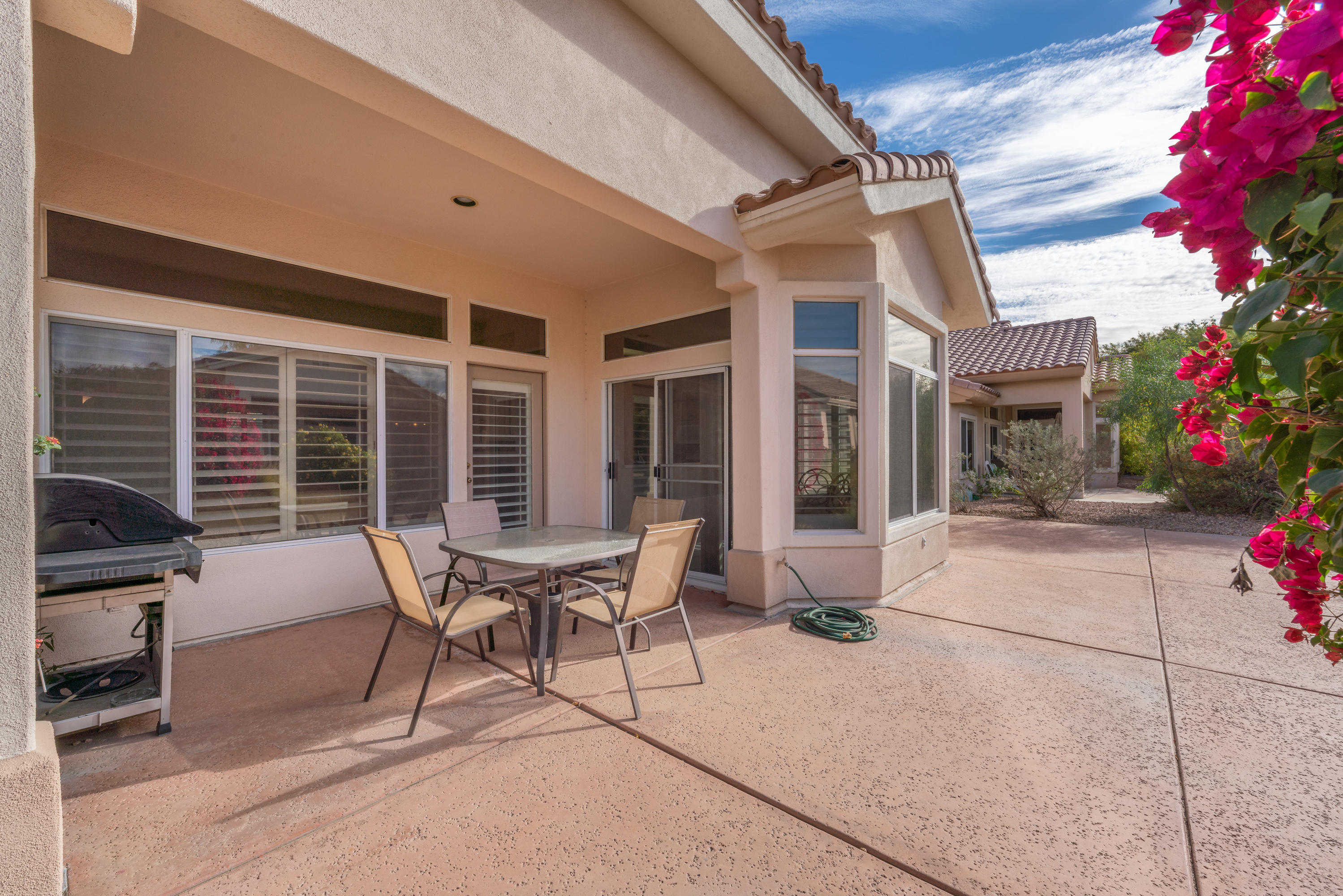 37395 Purple Shadow Road Palm Desert, CA 92211 - Photo 5 of 19 a building outdoor space with patio furniture and potted plants
