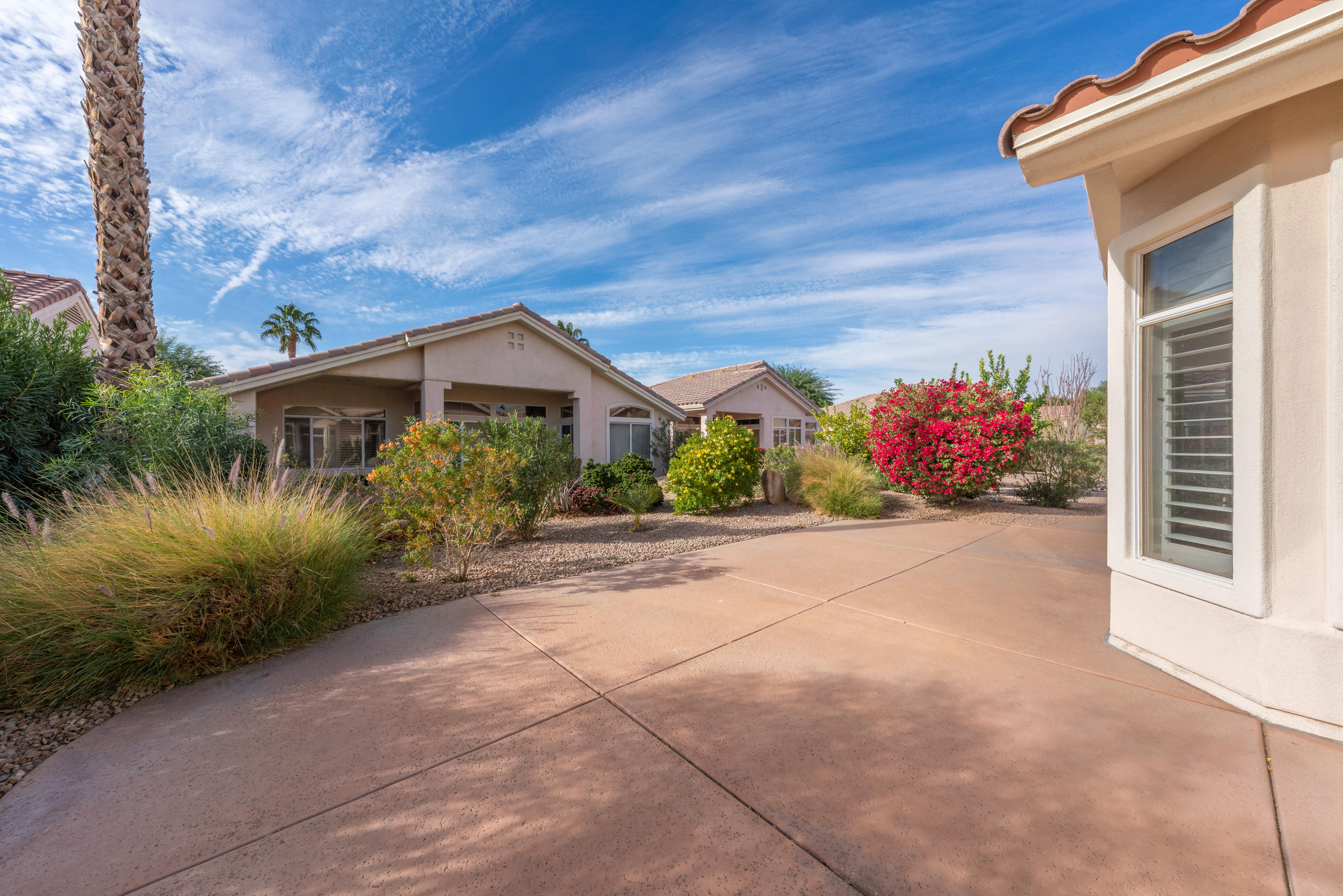 37395 Purple Shadow Road Palm Desert, CA 92211 - Photo 7 of 19 a front view of a house with a yard