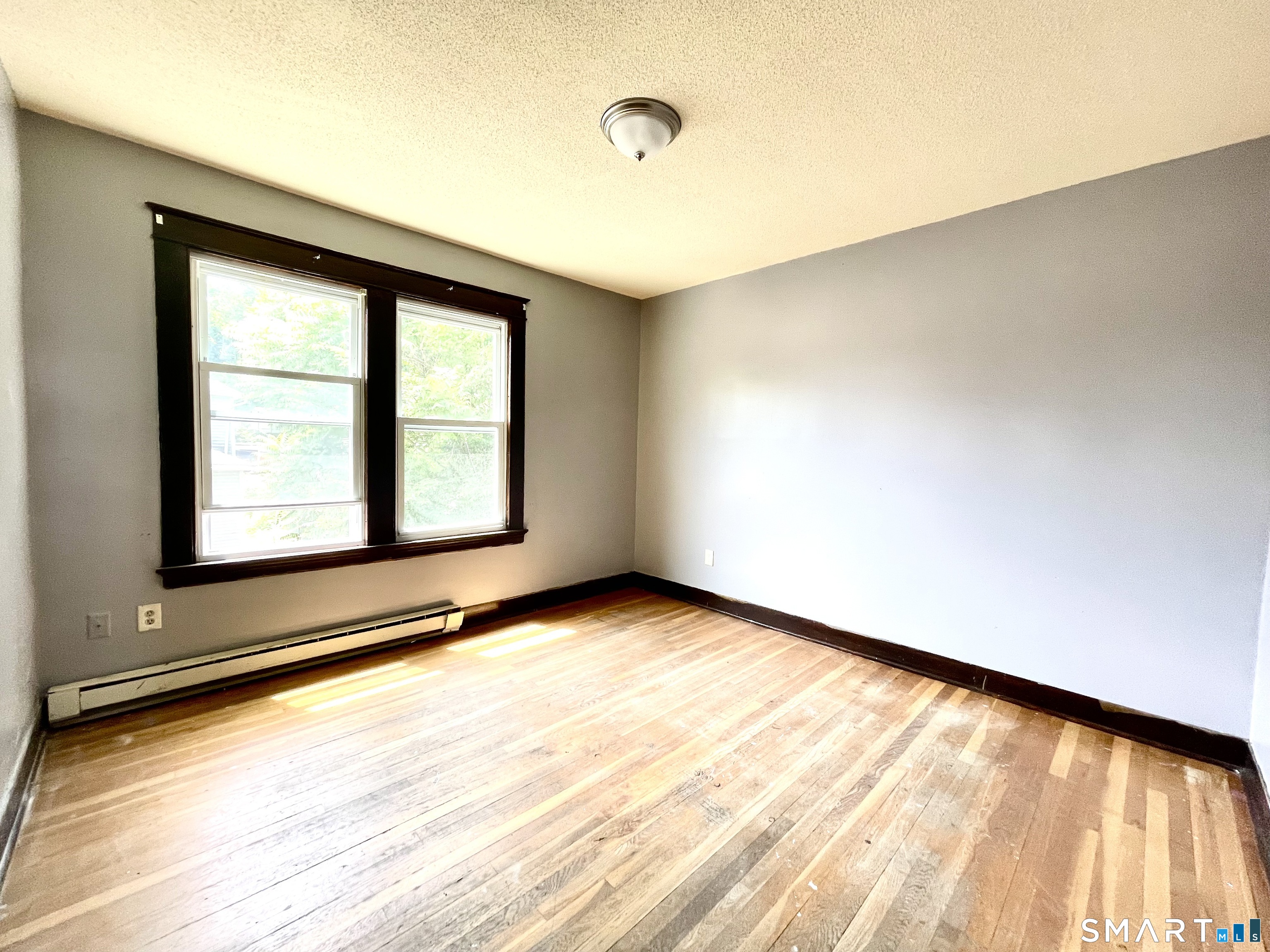 146 Charles Street, Unit 3 Waterbury, CT 06708 - Photo 20 of 20 a view of an empty room with a window