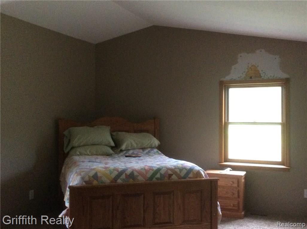 6591 Crofoot Road Fowlerville, MI 48836 - Photo 22 of 51 Master bedroom with his & her closets, full bath and leads to covered porch!