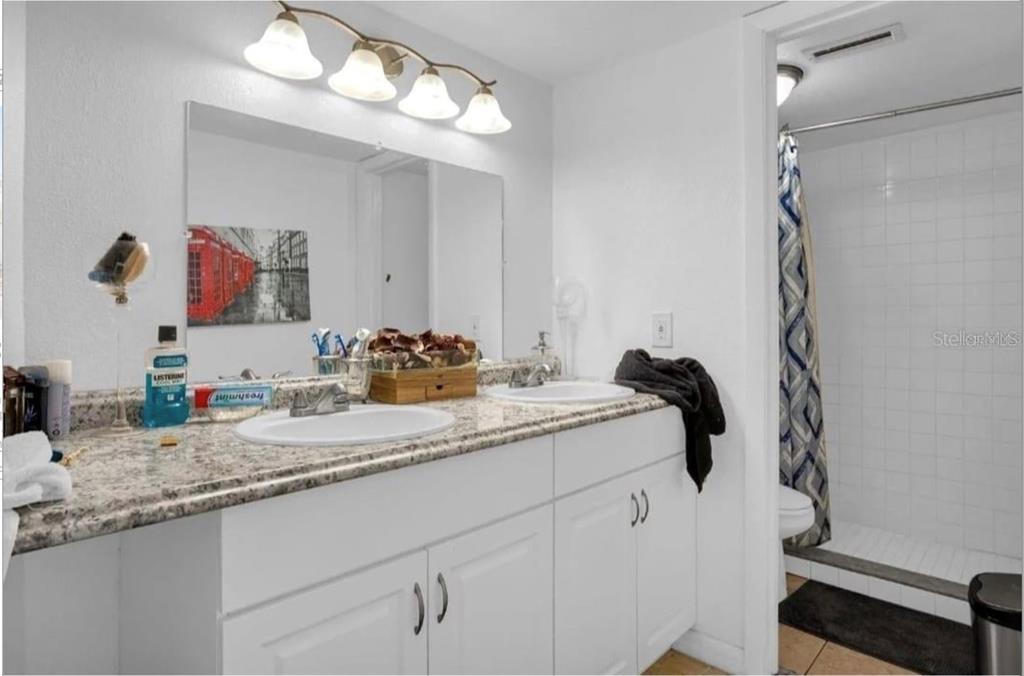 2604 Lemon Tree Lane, Unit C Orlando, FL 32839 - Photo 24 of 24 a bathroom with a sink and a mirror