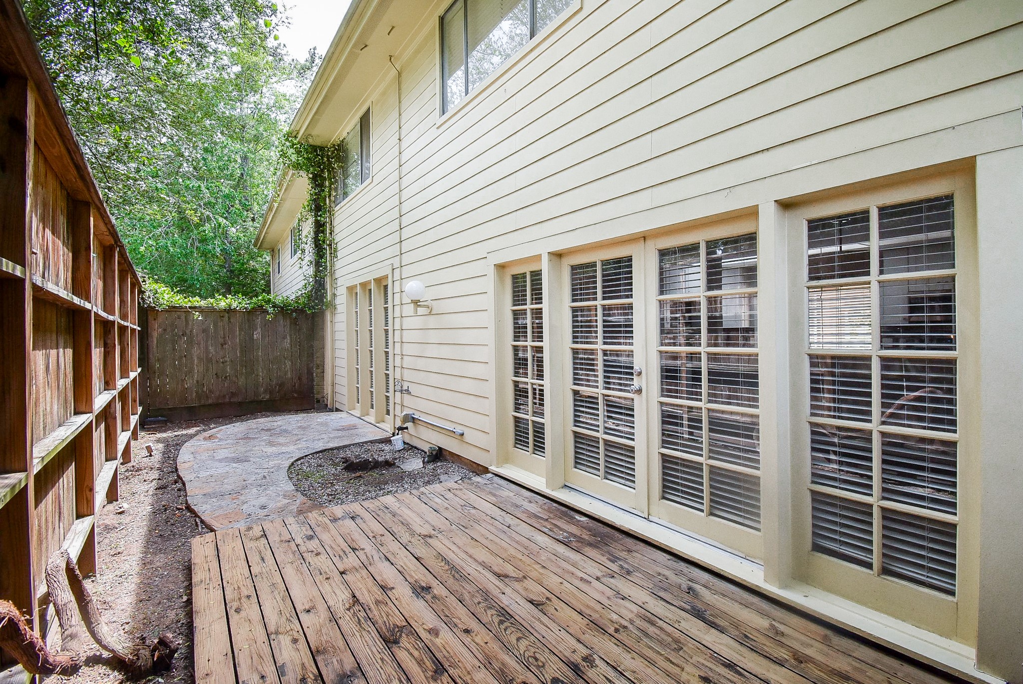 201 Vanderpool Lane, Unit 113 Houston, TX 77024 - Photo 38 of 45 a view of house with backyard and wooden floor