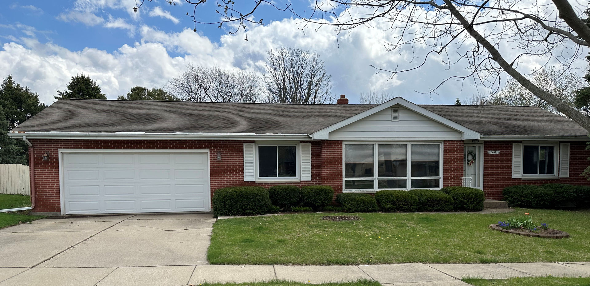 1401 Crest Lane Rochelle, IL 61068 - Photo 1 of 10 a front view of a house with a yard