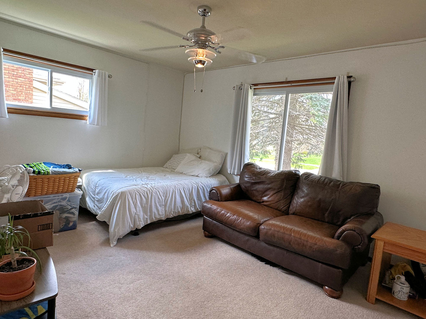 1401 Crest Lane Rochelle, IL 61068 - Photo 8 of 10 a bedroom with a bed couch and window